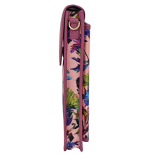 Load image into Gallery viewer, A rolled-up Anuschka yoga mat with a crossbody strap, featuring a tropical floral pattern.
