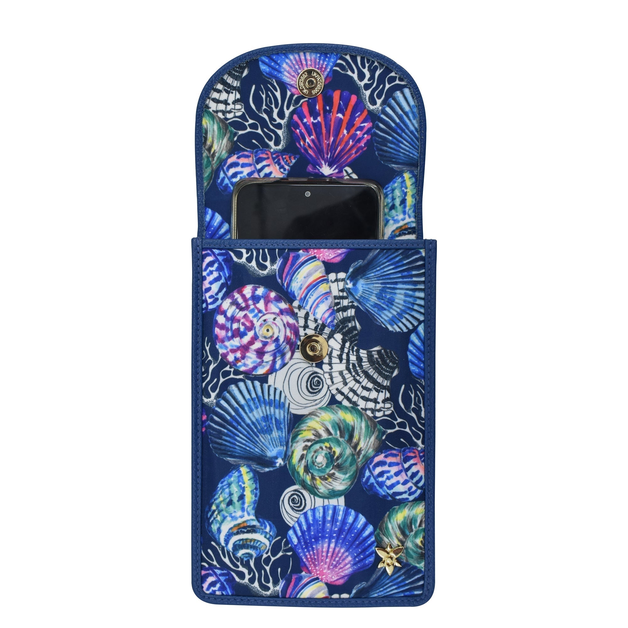 A Anuschka Fabric with Leather Trim Cell Phone Crossbody Wallet - 13005 tucked into a pouch with a colorful seashell pattern design, featuring RFID protection.