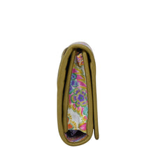 Load image into Gallery viewer, Side view of a closed Anuschka olive green Fabric with Leather Trim Three-Fold RFID Wallet - 13007 with card slots and a floral interior design.

