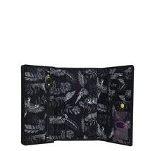 Load image into Gallery viewer, Anuschka&#39;s Fabric with Leather Trim Three-Fold RFID Wallet - 13007, featuring a tropical bird and foliage print, opens to show internal compartments including card slots and zip pockets.
