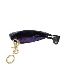 Load image into Gallery viewer, Anuschka Fabric with Leather Trim Zip Travel Pouch - 13008 with a gold clasp and zip entry, partially unzipped to show a purple interior.
