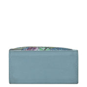Light blue genuine leather Triple Compartment Crossbody Organizer - 412 with colorful interior lining visible from the top by Anuschka.