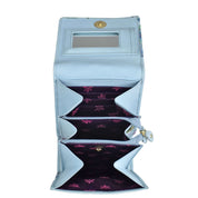 An open light blue Anuschka genuine leather wallet with multiple compartments and floral interior lining.