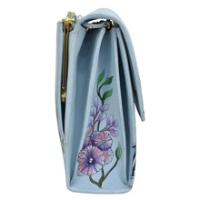 Load image into Gallery viewer, Blue leather Triple Compartment Crossbody Organizer - 412 with floral design and gold-tone hardware by Anuschka.

