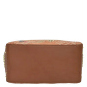 Brown genuine leather Anuschka Classic Hobo With Studded Side Pockets - 433 case with floral embroidery on the top edge.