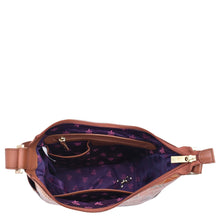 Load image into Gallery viewer, Brown genuine leather Anuschka fanny pack with open zipper showcasing the purple interior.
