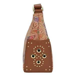Embossed floral print Anuschka Classic Hobo With Studded Side Pockets - 433 genuine leather bag with adjustable strap.
