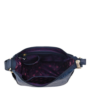 Blue Anuschka Classic Hobo With Studded Side Pockets - 433 waist bag with open zipper and printed inner lining.