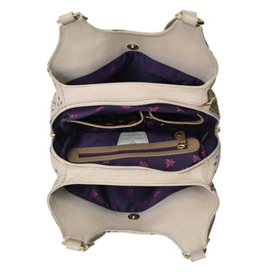 Open Anuschka Triple Compartment Satchel - 469 displaying interior compartments, a zippered pocket, and floral lining.