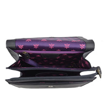 Load image into Gallery viewer, Open Anuschka black leather wallet with purple interior and a floral pattern.
