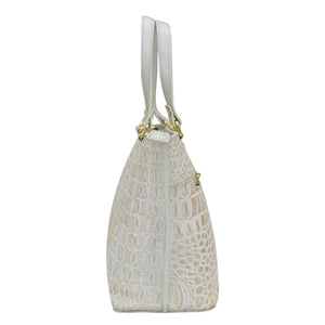 White embossed leather Medium Tote - 693 by Anuschka with a shoulder strap and gold-tone hardware, featuring a zippered pocket, isolated on a white background.