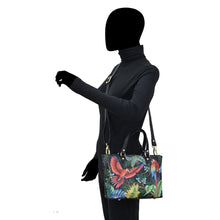 Load image into Gallery viewer, Mannequin displaying a colorful tropical print Medium Tote - 693 handbag with an adjustable handle by Anuschka.
