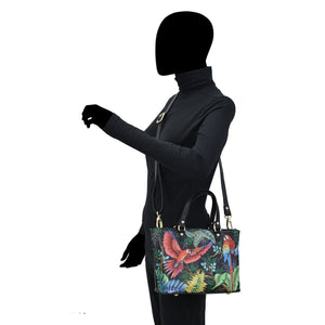 Mannequin displaying a colorful tropical print Medium Tote - 693 handbag with an adjustable handle by Anuschka.