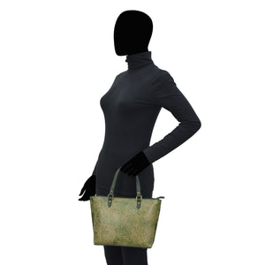Mannequin displaying a turtleneck and holding an Anuschka Medium Tote - 693.