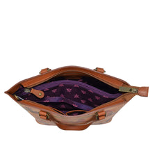 Load image into Gallery viewer, An open brown Anuschka Medium Tote - 693 with purple fabric interior and a floral hand-painted artwork visible inside.
