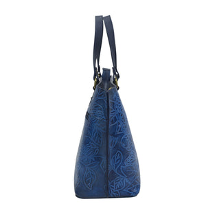 Anuschka Medium Tote - 693 with leaf pattern design against a white background and a zippered pocket.