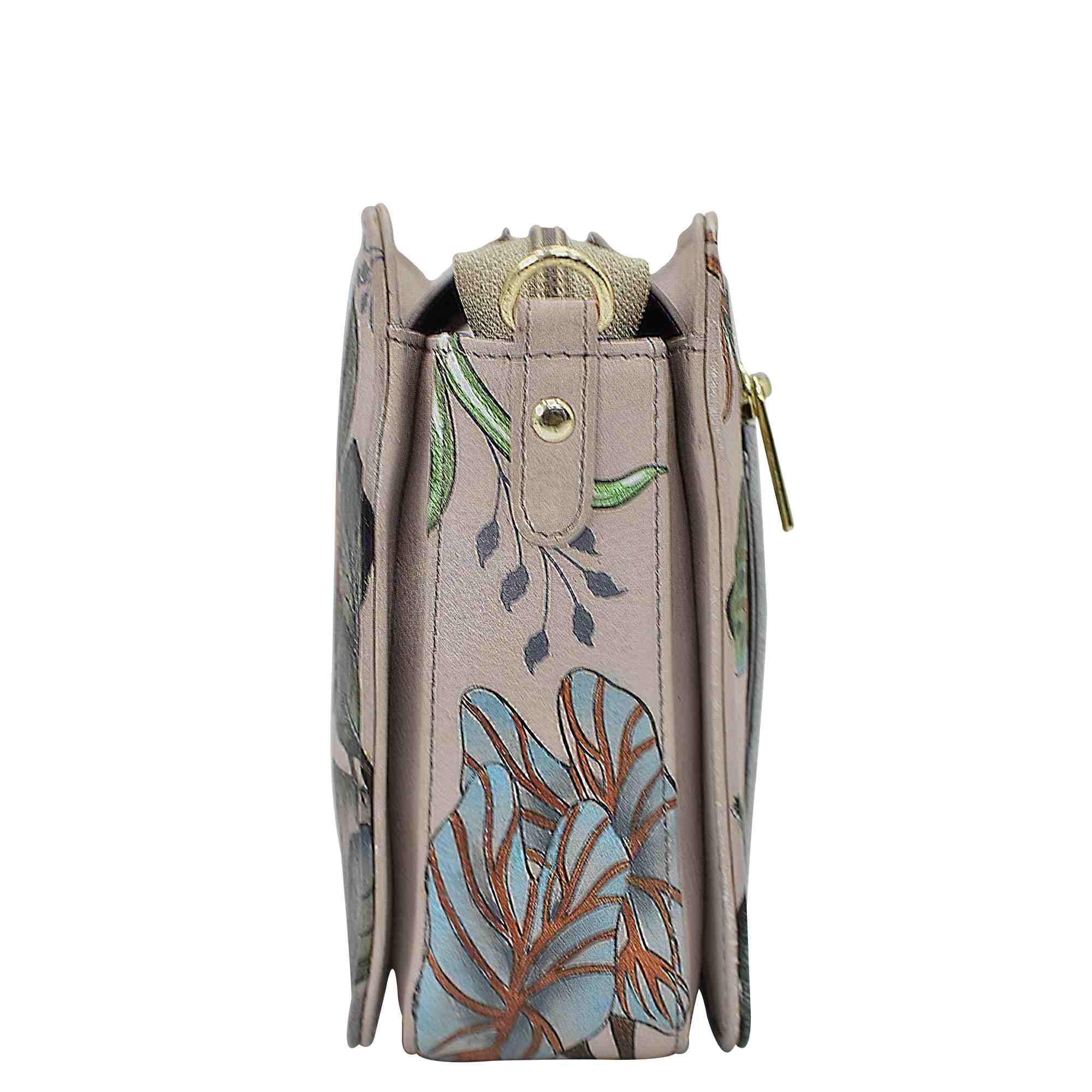 Side view of a beige Anuschka Triple Compartment Crossbody tote bag with a floral design.