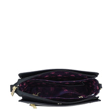 Load image into Gallery viewer, An open black Triple Compartment Crossbody - 696 handbag by Anuschka displaying a purple interior with a floral pattern and multiple compartments.
