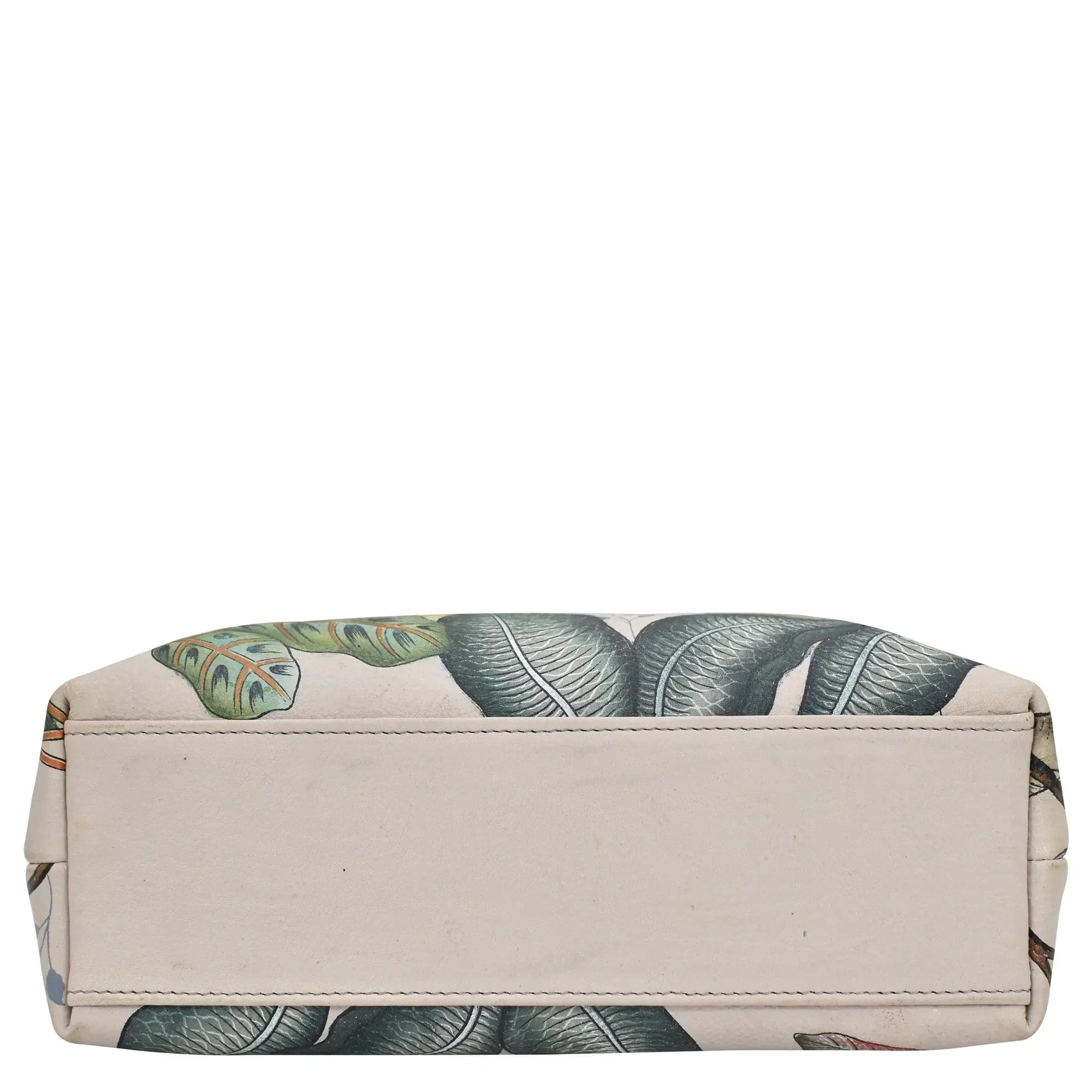 An Anuschka Medium Frame Crossbody - 700 with a leaf pattern on a white background.
