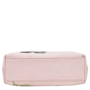 A pink floral-patterned, vintage-inspired Anuschka Medium Frame Crossbody - 700 on a white background.