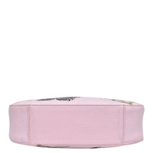 Load image into Gallery viewer, A pink floral Anuschka genuine leather cosmetic bag viewed from the side on a white background.
