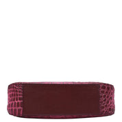 A side view of a burgundy Anuschka Small Convertible Hobo - 701 genuine leather crocodile embossed wallet on a white background.