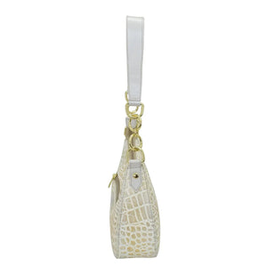 Light-colored, genuine leather crocodile pattern Small Convertible Hobo - 701 key pouch with a strap and gold-tone hardware, isolated on a white background by Anuschka.