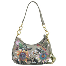 Load image into Gallery viewer, Anuschka style 701, Small Convertible Hobo. Floral Passion painting in Green color. Featuring Rear full length zip pocket &amp; Removable adjustable crossbody web strap.
