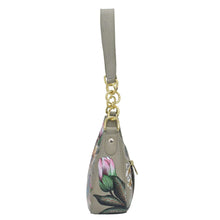 Load image into Gallery viewer, Floral-patterned genuine leather Small Convertible Hobo - 701 keychain purse with a wrist strap by Anuschka.
