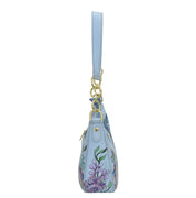 Light blue floral-patterned Small Convertible Hobo - 701 shoulder bag with a crossbody strap and gold tone hardware by Anuschka, isolated on a white background.