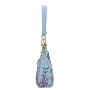 Light blue floral-patterned Small Convertible Hobo - 701 shoulder bag with a crossbody strap and gold tone hardware by Anuschka, isolated on a white background.