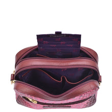 Load image into Gallery viewer, Open Anuschka Twin Top Messenger - 704 pink leather bag with zipper compartments, gold-tone hardware, and RFID protected.
