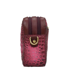 Load image into Gallery viewer, Anuschka Twin Top Messenger - 704 with crocodile pattern, gold-tone hardware, and an adjustable strap.

