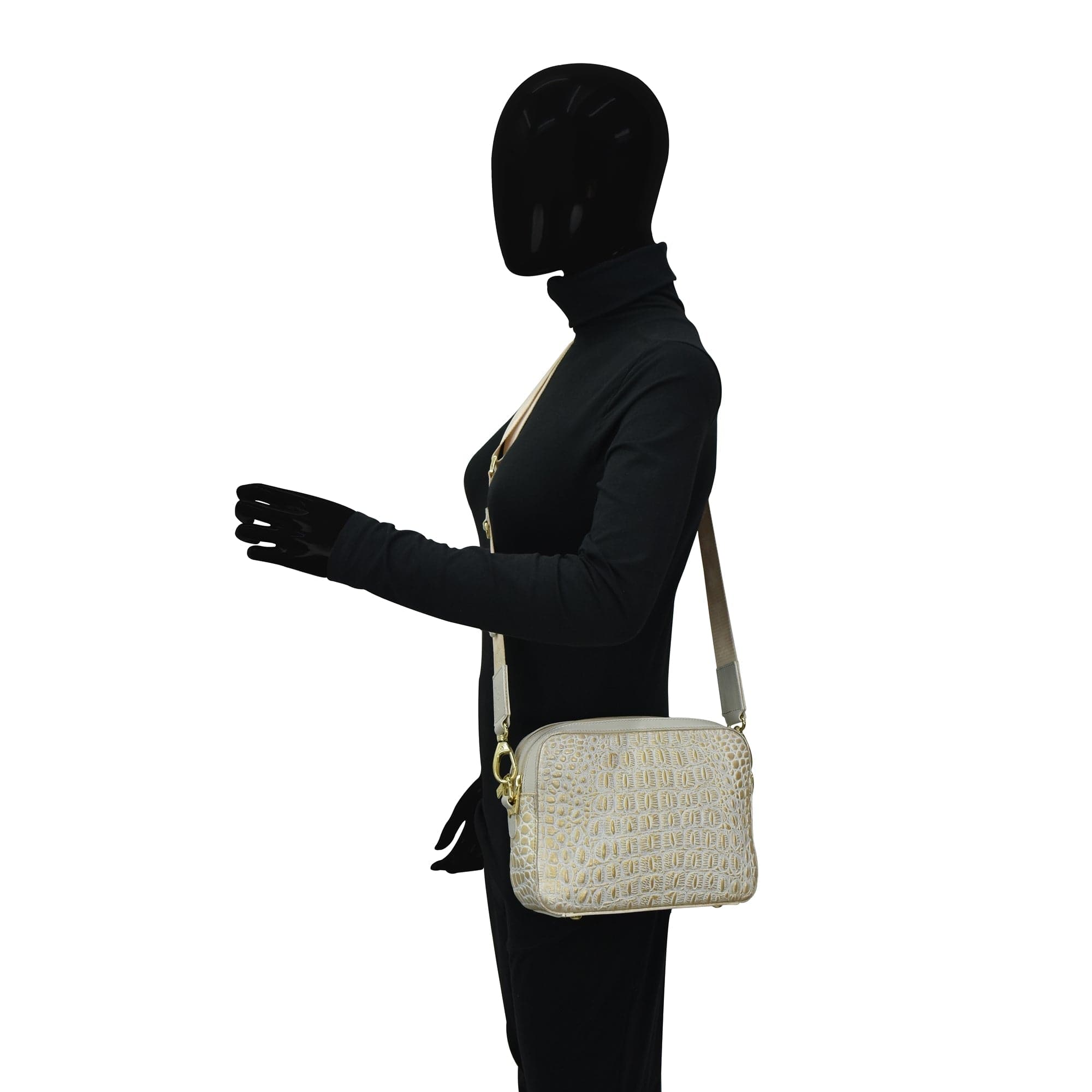 Mannequin in black attire with a masked face displaying an Anuschka Twin Top Messenger - 704 structured purse and white shoulder bag.