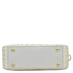 White rectangular structured purse with crocodile texture and gold-tone stud accents, like the Twin Top Messenger - 704 from Anuschka.