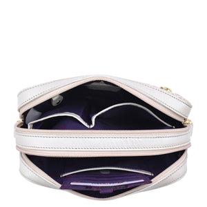 An open white Anuschka Twin Top Messenger - 704 showcasing its purple interior, compartments, and RFID protected card case.