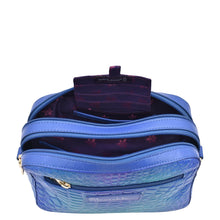 Load image into Gallery viewer, Blue Anuschka Twin Top Messenger - 704 with multiple compartments, zippers, and RFID protection.
