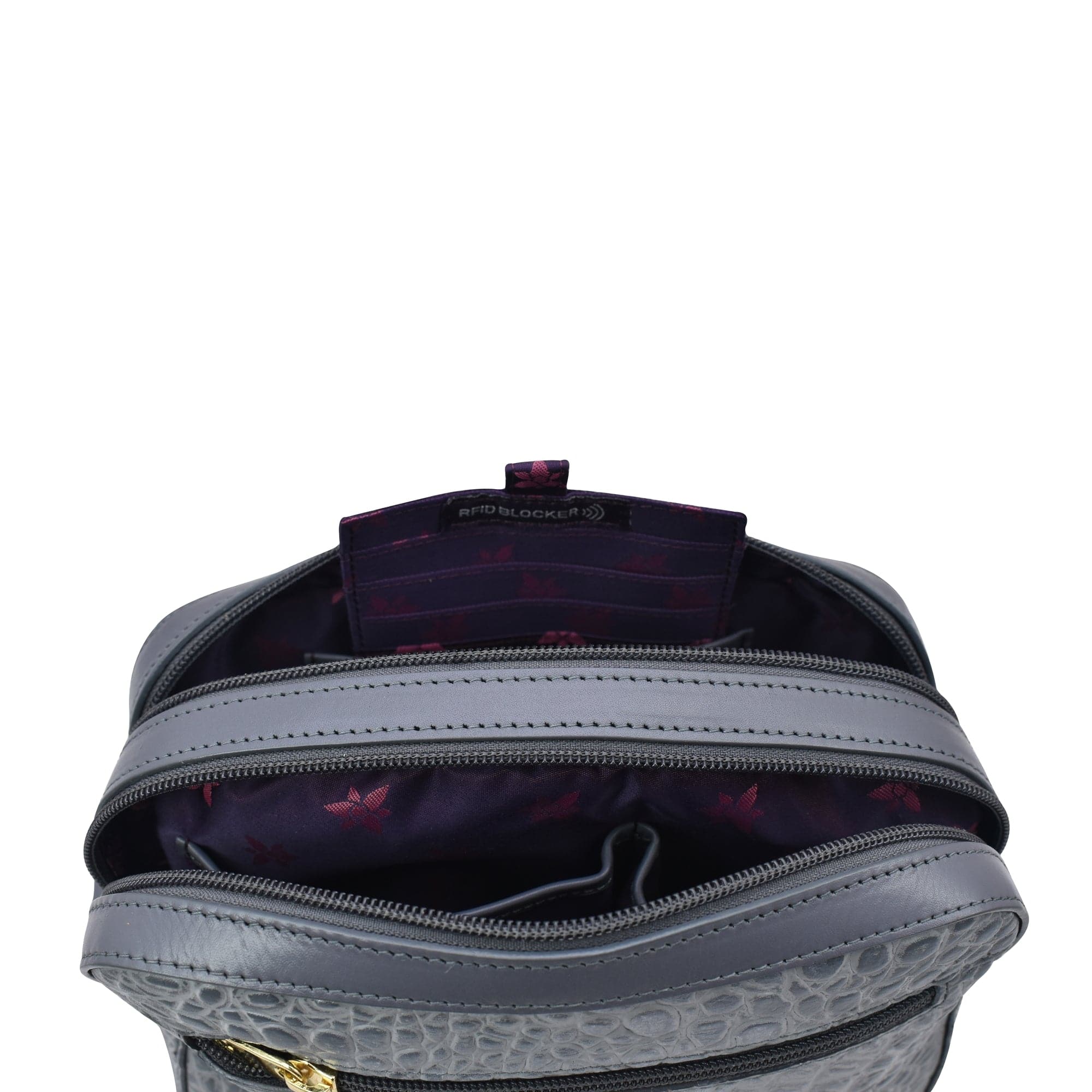 Open empty Anuschka Twin Top Messenger - 704 with a patterned, RFID protected interior displayed against a white background.