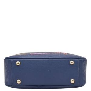 Navy blue Anuschka Twin Top Messenger - 704 with floral patterns and metal stud details, RFID protected, on a white background.