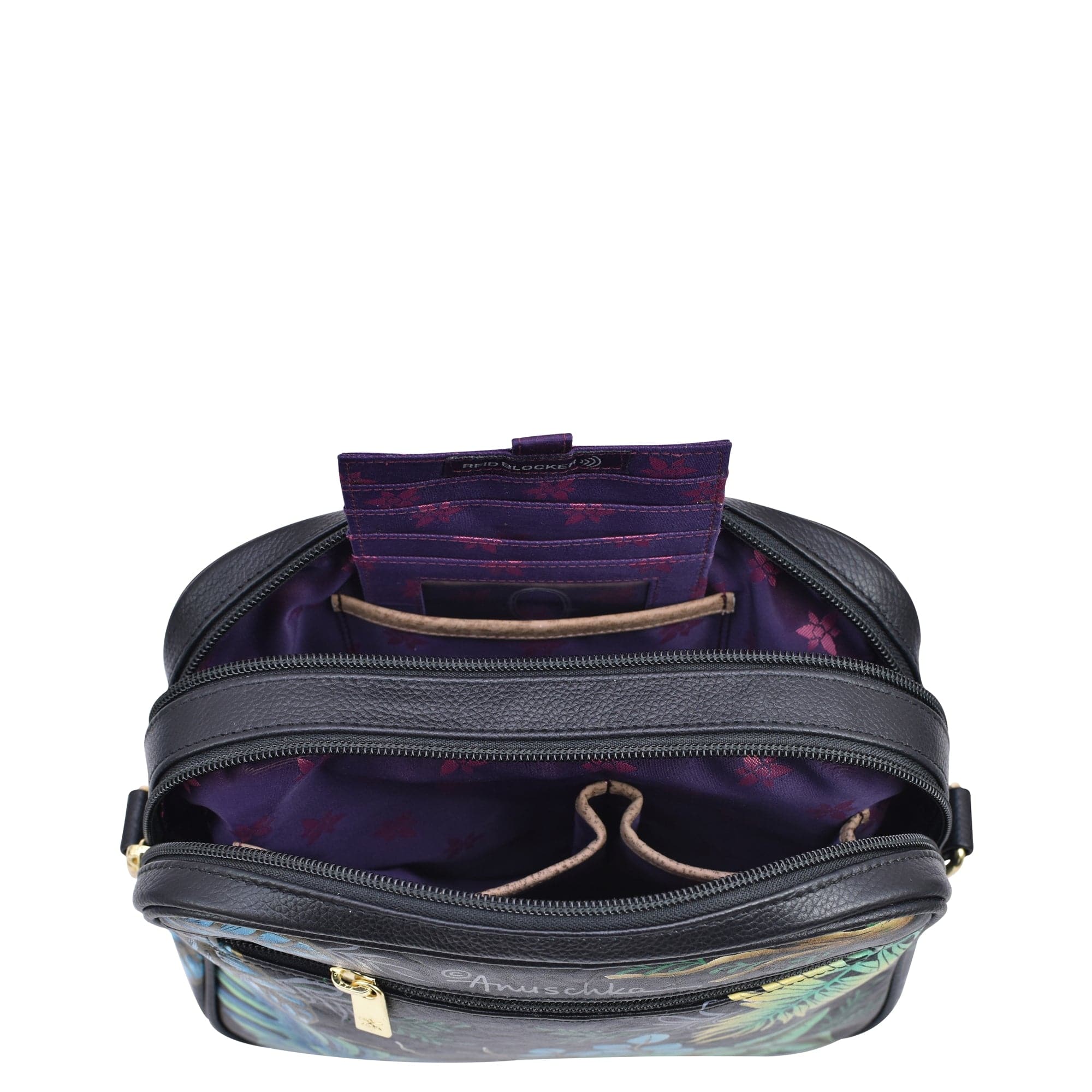 Open Anuschka Twin Top Messenger - 704 revealing a purple, RFID protected interior and compartments.