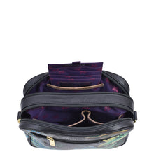 Load image into Gallery viewer, Open Anuschka Twin Top Messenger - 704 revealing a purple, RFID protected interior and compartments.
