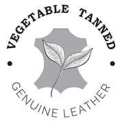 Logo for Anuschka's Accordion Flap Wallet - 1174 crafted from vegetable-tanned genuine leather, featuring a leaf emblem and RFID protection.